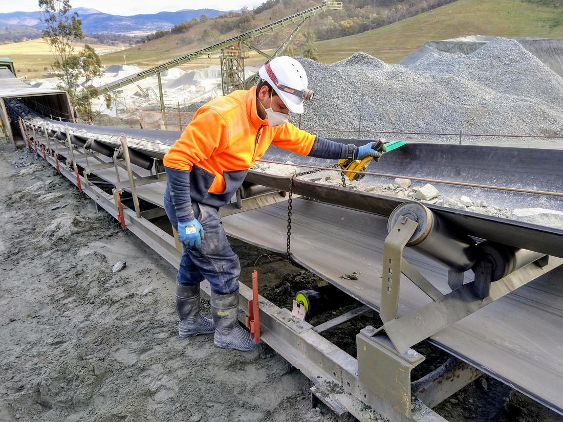 Conveyor inspection and clean-up at a quarry processing plant